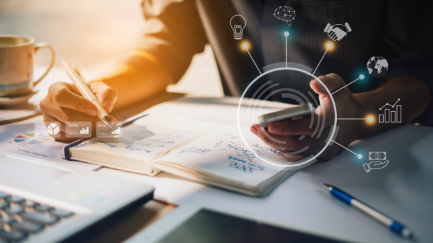 businessman-analyzing-company-financial-report-with-augmented-reality-graphics_34141-360